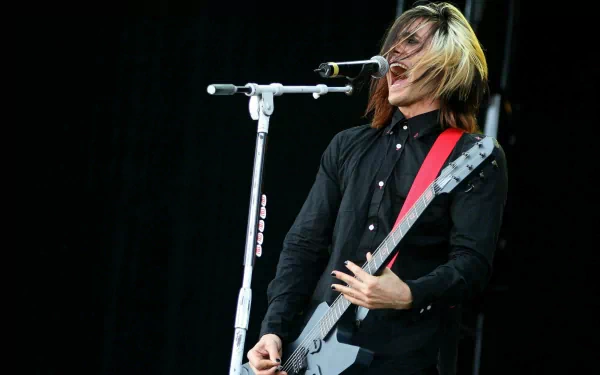 HD PC desktop wallpaper featuring a dynamic image of Thirty Seconds to Mars performing live, capturing the energy of rock music.