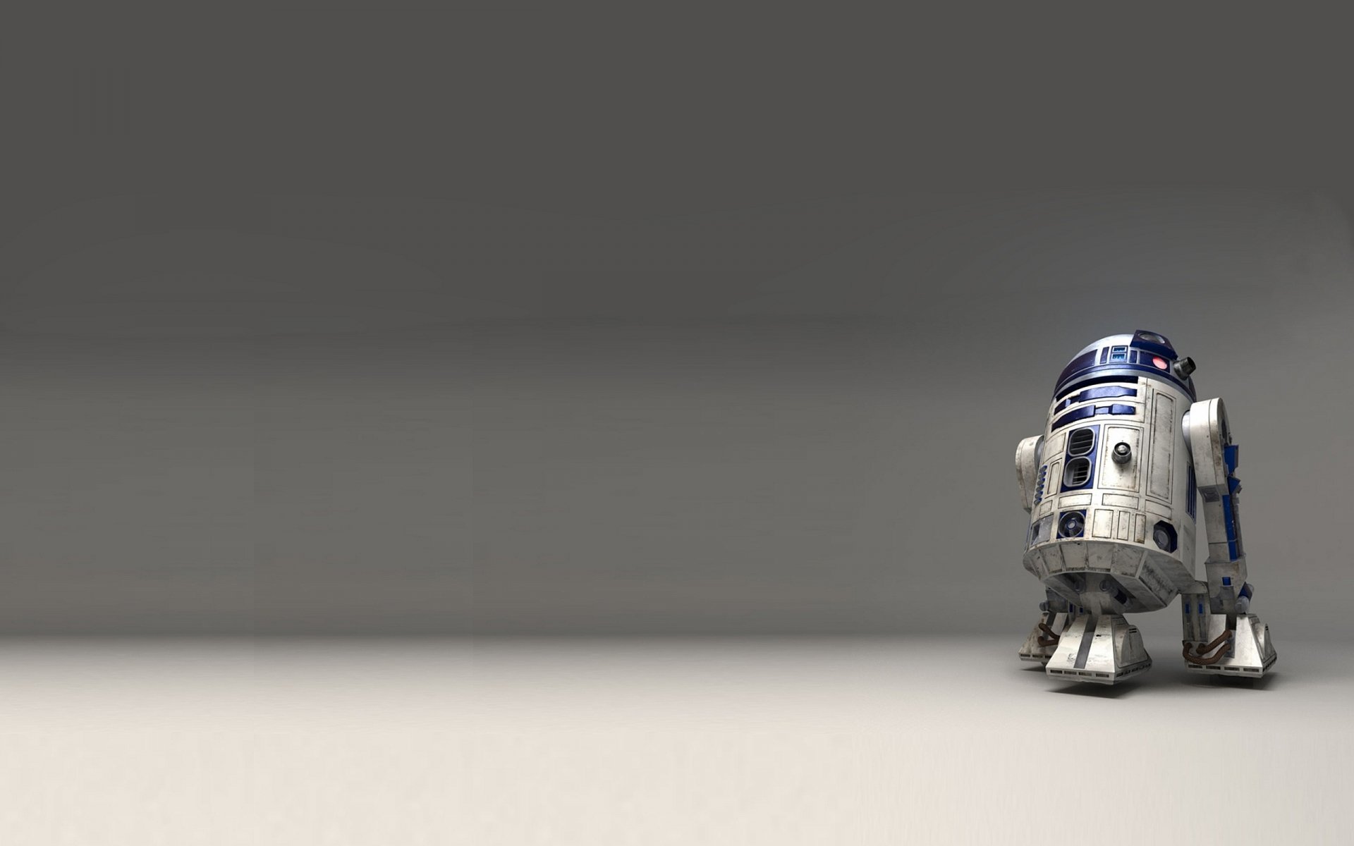 HD PC desktop wallpaper featuring Star Wars' R2-D2 droid standing alone against a minimalist gray background.