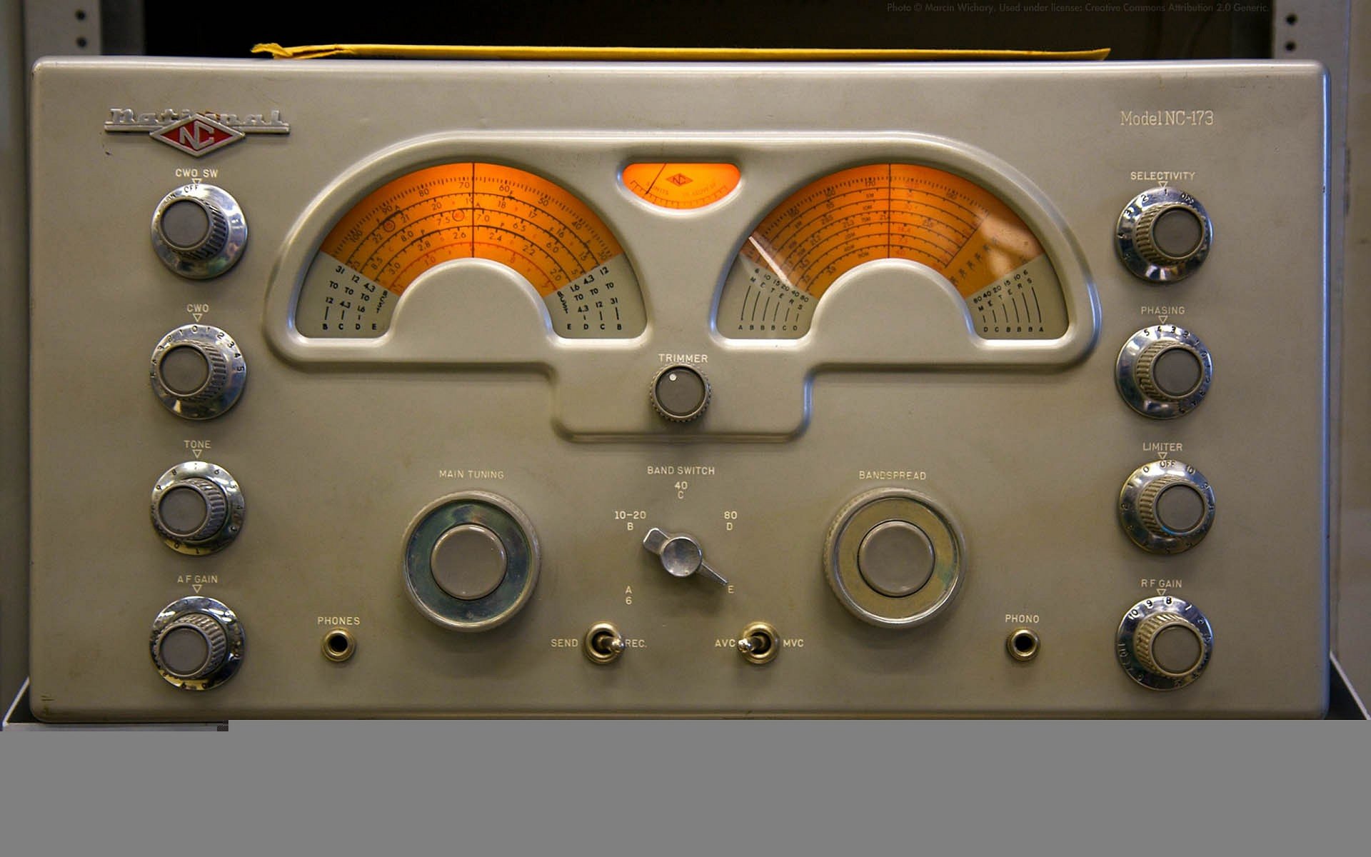 HD PC desktop wallpaper featuring a vintage radio tuner with glowing orange dials, capturing a classic music and radio theme.