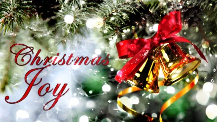 A festive desktop wallpaper featuring shiny gold bells adorned with a red ribbon, surrounded by sparkling Christmas ornaments and lights, capturing the essence of holiday joy.