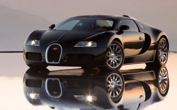 Black Bugatti Veyron sports car reflected on a glossy surface — HD PC desktop wallpaper background showcasing sleek curves and polished chrome wheels.