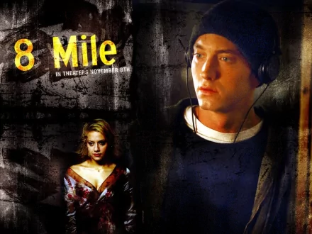 HD desktop wallpaper of the 8 Mile movie poster: a pensive male rapper in headphones beside a woman against a gritty urban backdrop, dramatic film poster design.