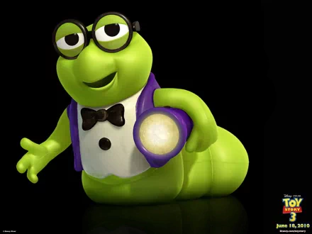 HD PC desktop wallpaper of the green worm character from the Toy Story 3 movie, wearing glasses, a tuxedo vest and bow tie, holding a glowing light against a black background.