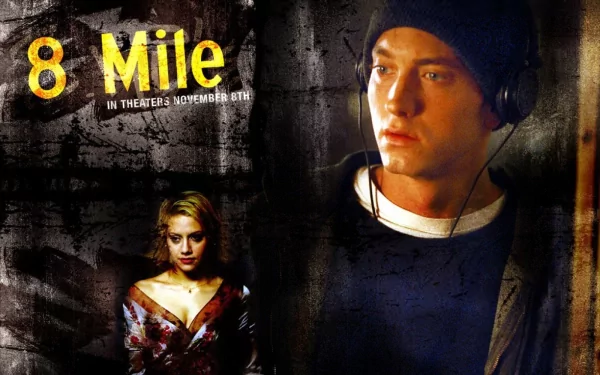 HD desktop wallpaper of the 8 Mile movie poster: a pensive male rapper in headphones beside a woman against a gritty urban backdrop, dramatic film poster design.