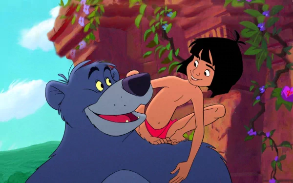 HD desktop wallpaper featuring a scene from The Jungle Book (1967) of Baloo the bear and Mowgli, set against a vibrant jungle backdrop.