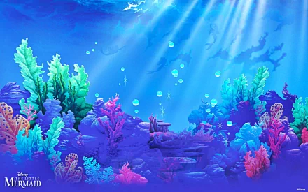 Vibrant underwater scene inspired by The Little Mermaid, featuring colorful coral and soft beams of light filtering through the ocean waves, capturing the magic of the 1989 movie.