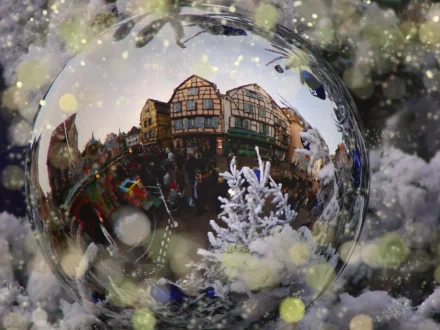 A detailed snow globe capturing a festive holiday scene with Christmas decorations, featured as an HD PC desktop wallpaper and background.