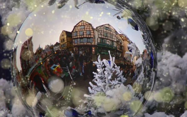 A detailed snow globe capturing a festive holiday scene with Christmas decorations, featured as an HD PC desktop wallpaper and background.