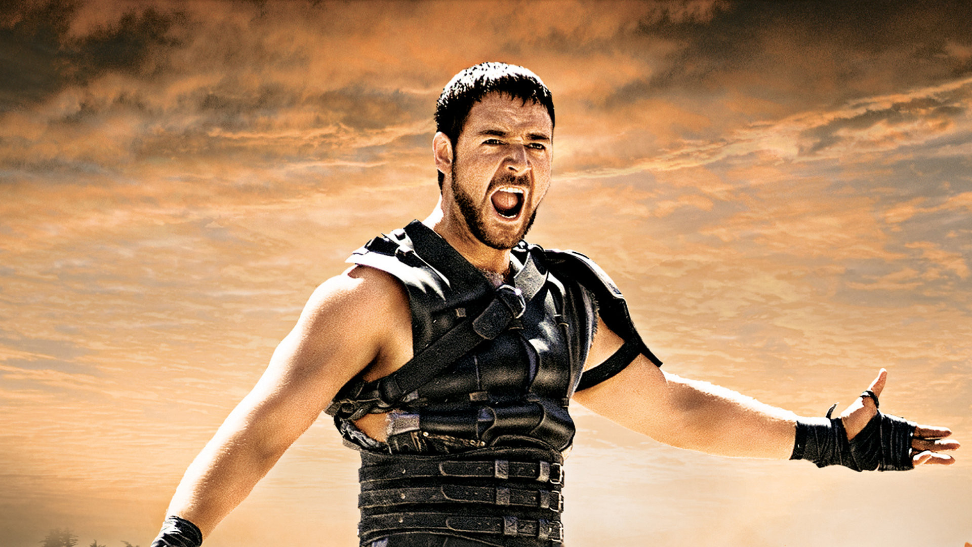 HD wallpaper featuring a gladiator with arms outstretched and shouting, set against a dramatic cloudy sky background.