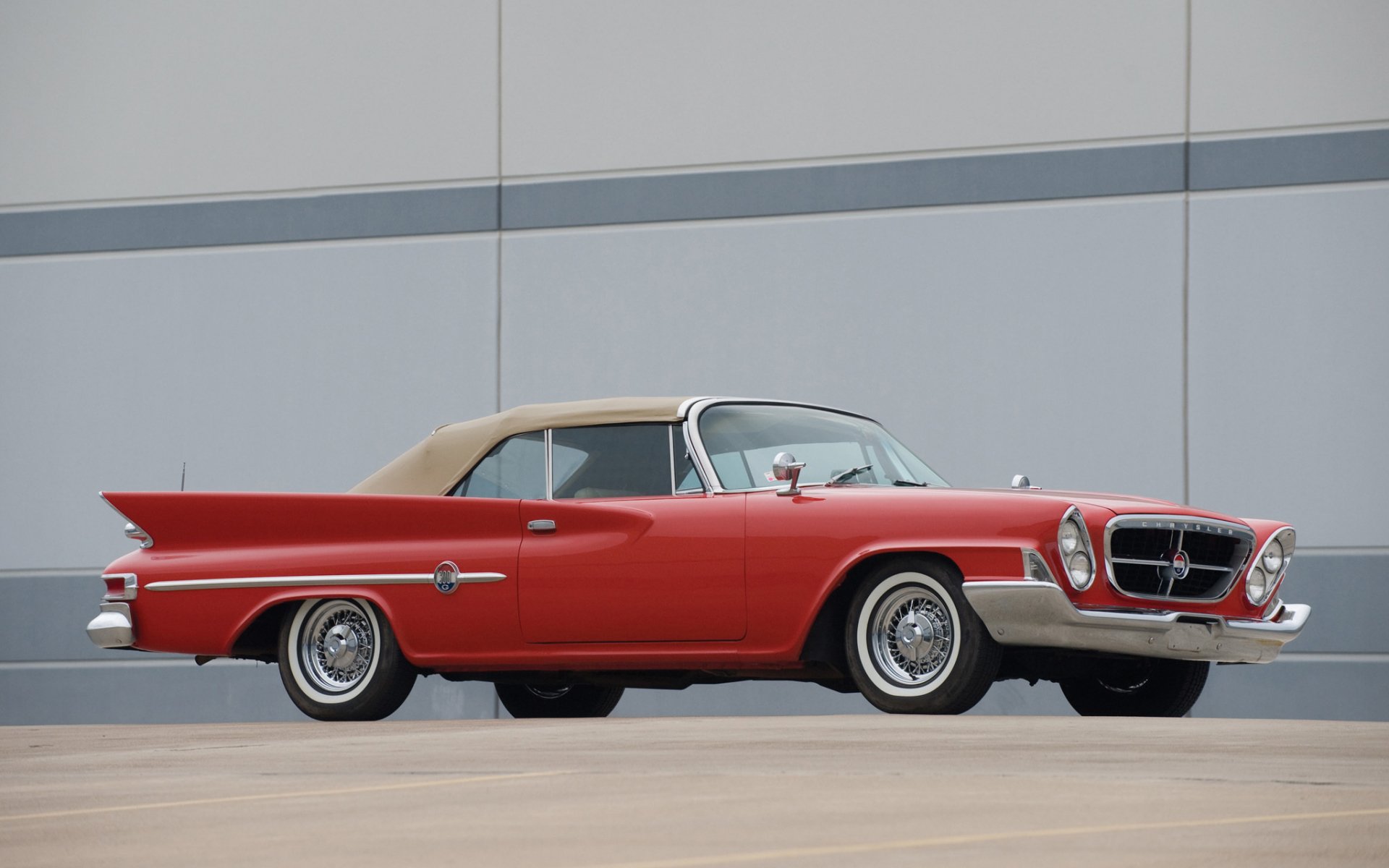 HD PC desktop wallpaper: red vintage Chrysler vehicle with beige roof, side profile parked against a minimalist gray wall.