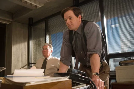 Mark Wahlberg in a scene from the movie *The Departed*, featuring a tense moment in an office setting. This HD wallpaper captures the film's gripping atmosphere.