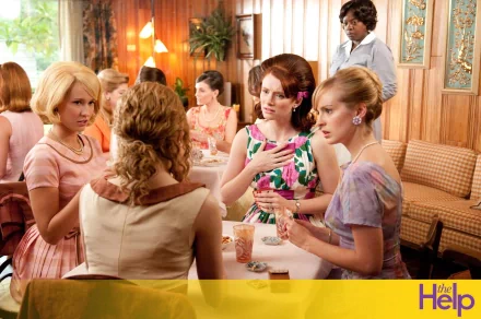 HD desktop wallpaper from The Help featuring Bryce Dallas Howard in a 1960s-style diner setting with other characters.