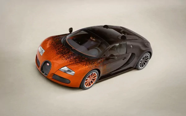 A sleek Bugatti Veyron 16.4 Grand Sport in a striking orange and black design, showcased as an HD PC desktop wallpaper and background.
