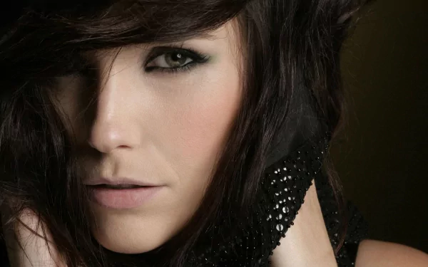 Close-up portrait of celebrity Sophia Bush with dark hair and intense gaze, featured as an HD PC desktop wallpaper and background.