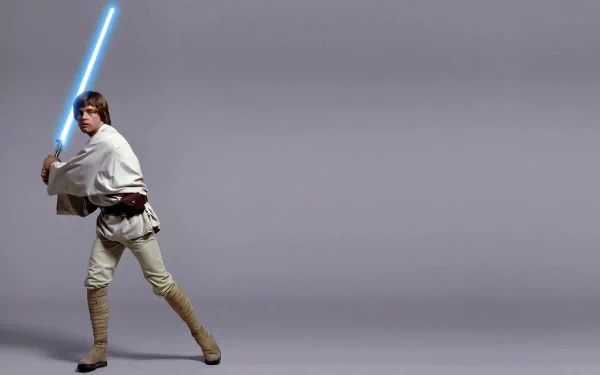 HD desktop wallpaper featuring Luke Skywalker from Star Wars Episode IV: A New Hope, poised with a blue lightsaber.