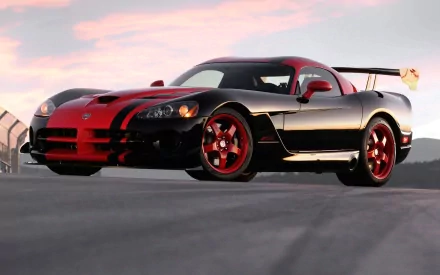 A black and red Dodge Viper sports car with striking red accents, captured as a high-definition desktop wallpaper and background.