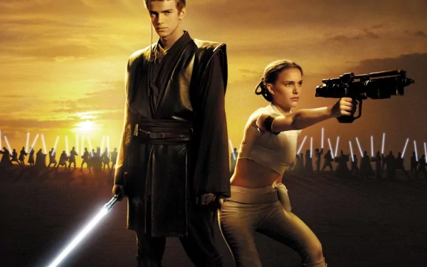 HD wallpaper from Star Wars Episode II featuring Anakin Skywalker with a blue lightsaber and Padmé Amidala holding a gun.