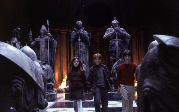 HD wallpaper of Hermione, Harry, and Ron from Harry Potter and the Philosopher's Stone in a scene with life-size chess pieces.