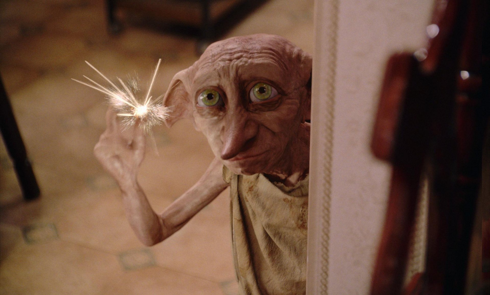 HD wallpaper from Harry Potter and the Chamber of Secrets featuring Dobby with a magical sparkle.