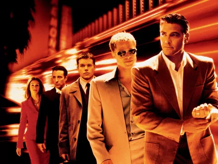 HD wallpaper featuring iconic Ocean's Eleven cast including George Clooney, Brad Pitt, Matt Damon, Andy García, and Julia Roberts amidst a vibrant backdrop.
