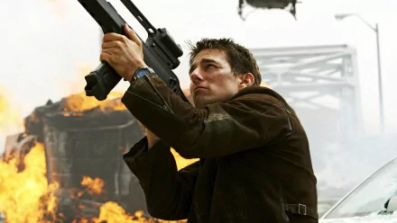 Action-packed HD desktop wallpaper from Mission: Impossible III, featuring the protagonist armed and ready amidst explosive chaos.