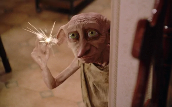 HD wallpaper from Harry Potter and the Chamber of Secrets featuring Dobby with a magical sparkle.