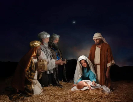 HD desktop wallpaper featuring a nativity scene with the holy family and three wise men under a star-lit sky, evoking the spirit of Christmas and the holiday season.