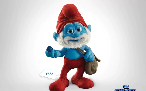 HD desktop wallpaper featuring Papa Smurf from the movie The Smurfs, holding a blue gem and wearing his classic red hat and pants. The movie title, “The Smurfs,” is displayed in the bottom right corner.
