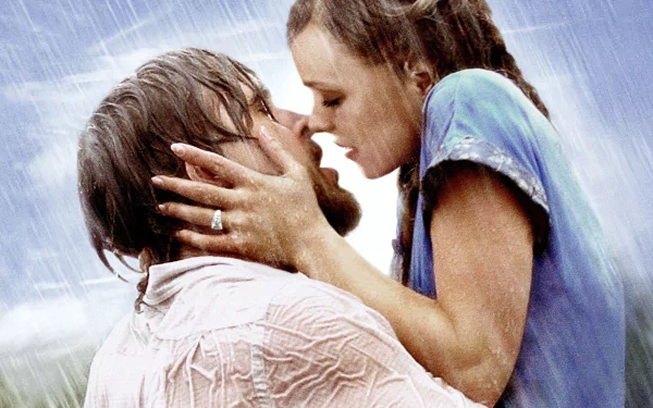 HD PC desktop wallpaper featuring an iconic romantic scene from the movie The Notebook, showing a couple embracing passionately in the rain.