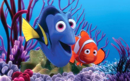 HD PC desktop wallpaper of Dory and Nemo from the movie Finding Nemo swimming together amid colorful coral and sea plants.
