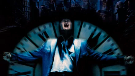 Dark City movie HD PC desktop wallpaper: blue-lit man in a suit screaming before a giant clock, shadowy city skyline behind him.