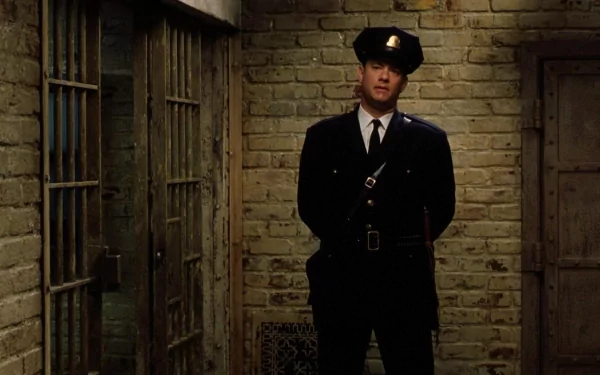 HD PC desktop wallpaper featuring Tom Hanks in his role as a prison guard from the movie The Green Mile, standing in a dimly lit brick corridor.