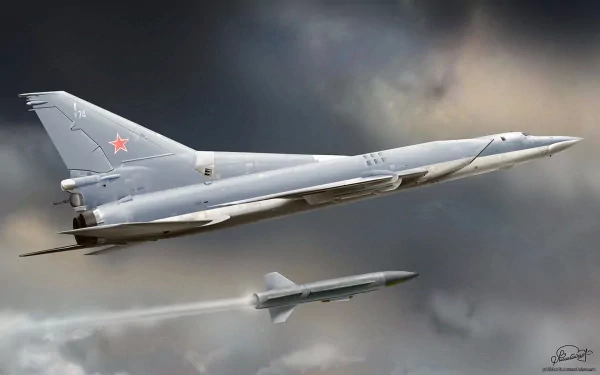 HD desktop wallpaper featuring a military Tupolev Tu-22 bomber in flight against a dramatic cloudy sky.