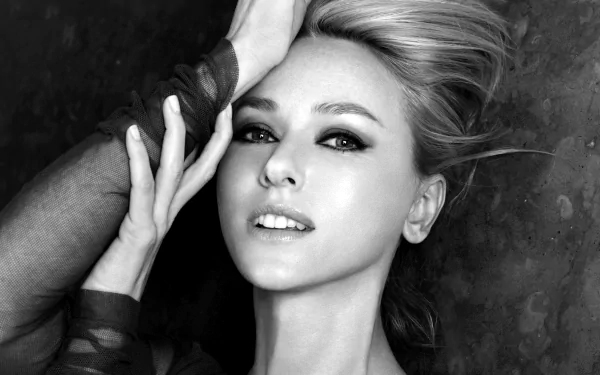 A striking black and white HD wallpaper featuring Naomi Watts, showcasing her captivating gaze and elegant pose against a textured background.