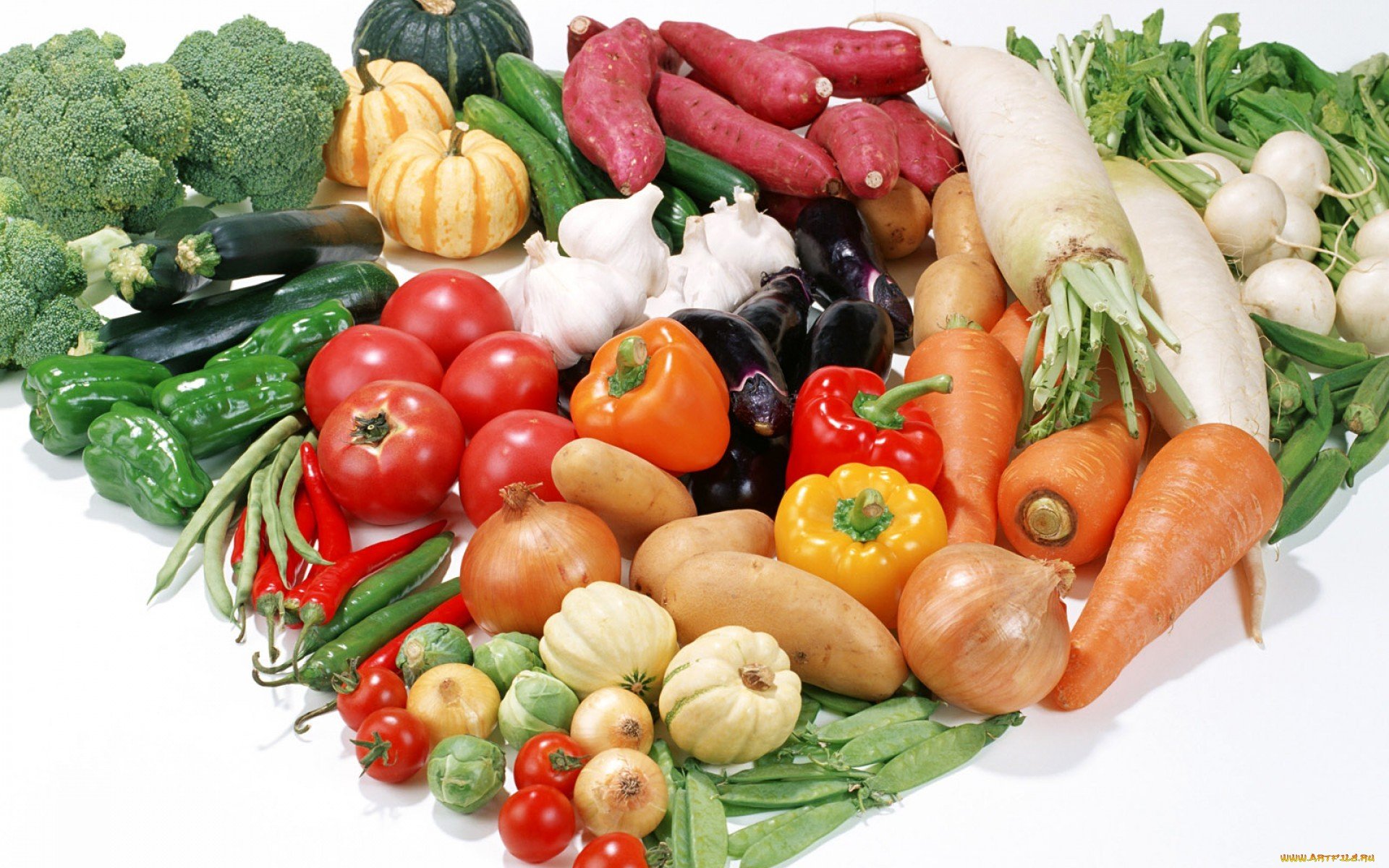 HD PC desktop wallpaper featuring a vibrant assortment of fresh vegetables including broccoli, tomatoes, carrots, peppers, and more arranged on a white background.
