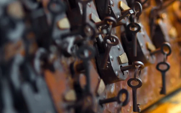 HD PC desktop wallpaper featuring a close-up of vintage man-made keys hanging on locks with a blurred background.
