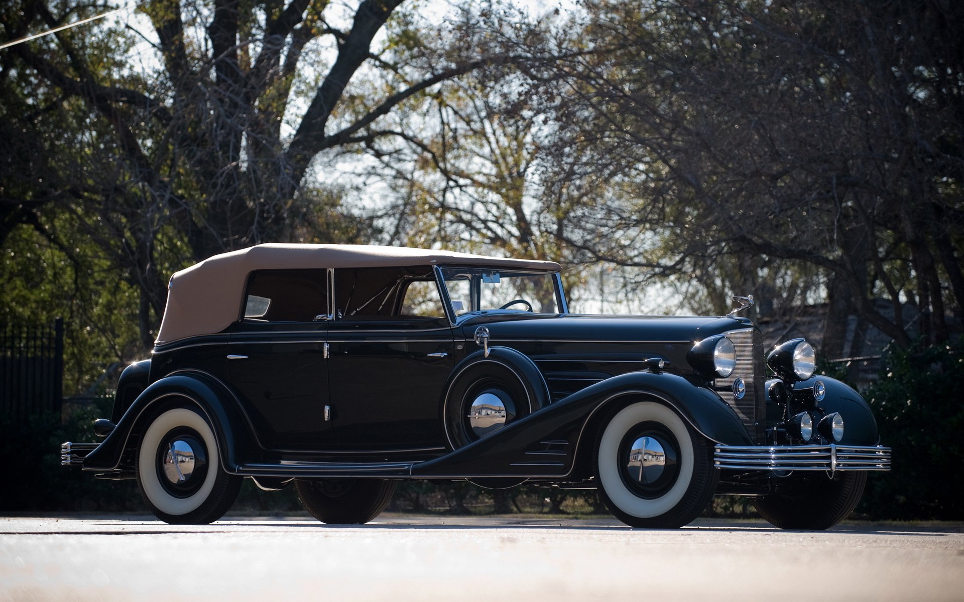 A classic 1933 Cadillac V16 convertible parked outdoors, captured in high definition for a PC desktop wallpaper background.