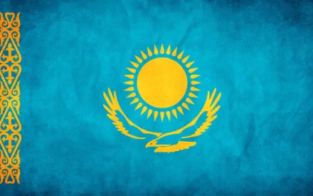 HD PC desktop wallpaper of the flag of Kazakhstan: turquoise field with a gold sun, a soaring steppe eagle, and a decorative hoist pattern.