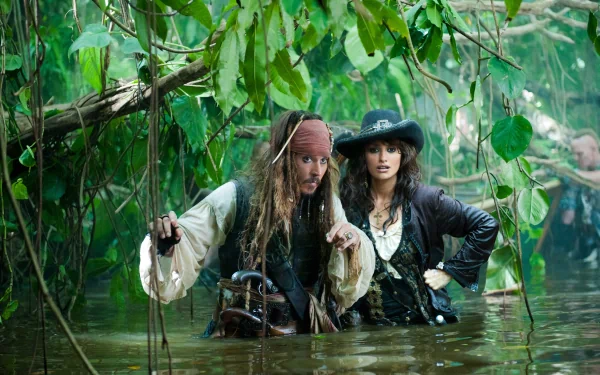 Jack Sparrow and Angelica Teach navigate a lush, rainy jungle in this HD wallpaper from Pirates of the Caribbean: On Stranger Tides, featuring Johnny Depp and Penelope Cruz.