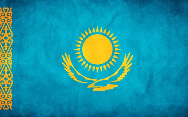 HD PC desktop wallpaper of the flag of Kazakhstan: turquoise field with a gold sun, a soaring steppe eagle, and a decorative hoist pattern.