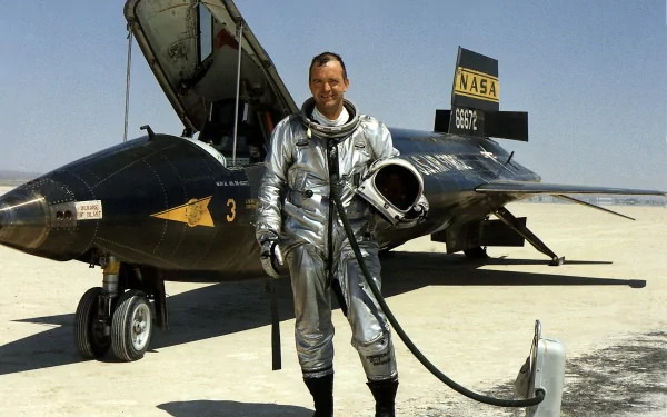 A North American X-15 aircraft on the ground with a pilot in a silver suit, showcasing military aviation history in a high-definition desktop wallpaper.