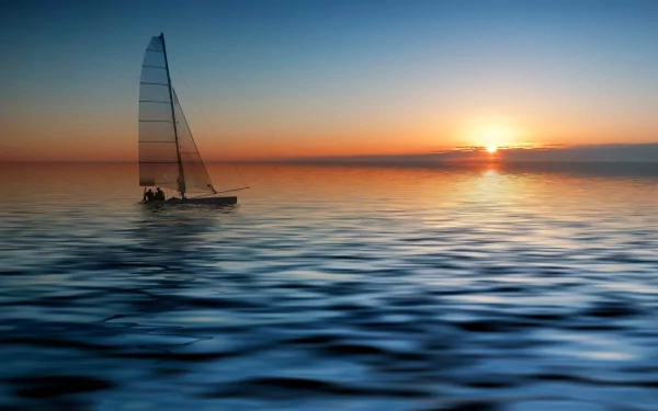 HD desktop wallpaper featuring a sailboat gliding across calm water at sunset, capturing a serene and picturesque maritime scene.