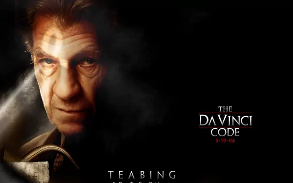 HD wallpaper featuring Ian McKellen in a dramatic pose from the movie The Da Vinci Code, with dark tones and the film's title prominently displayed.