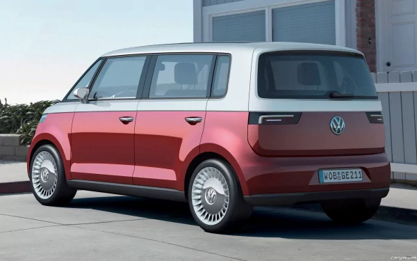 Rear three-quarter view of a red-and-white 2011 Volkswagen Bulli parked by a modern house — HD PC desktop wallpaper background.