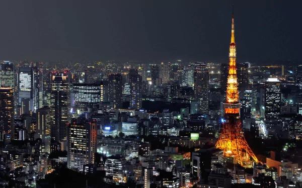 Night view of Tokyo cityscape featuring the illuminated Tokyo Tower, a prominent man-made landmark in Japan, captured in HD quality for a desktop wallpaper.