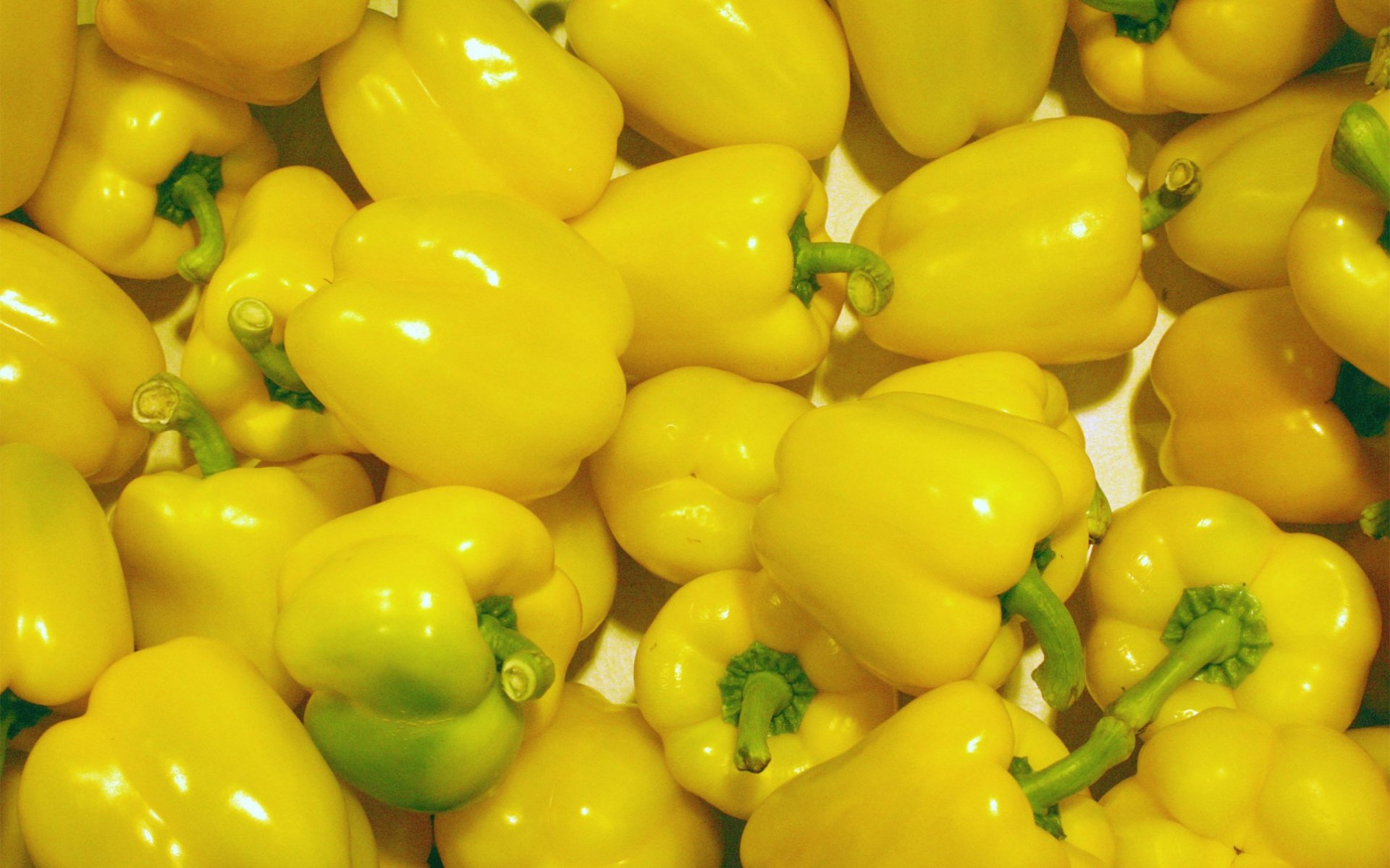 HD PC desktop wallpaper: close-up of glossy yellow bell peppers filling the frame — food, pepper background.