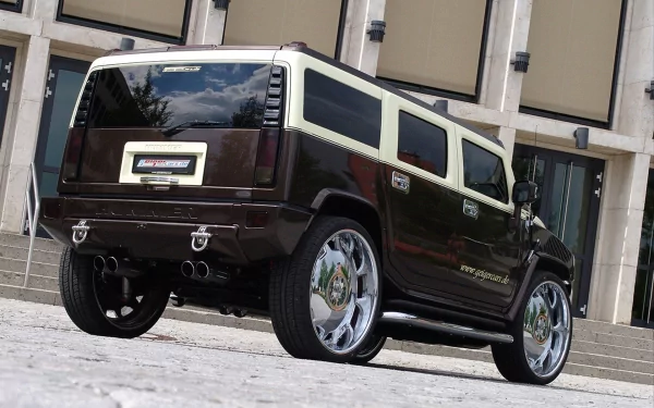 HD PC desktop wallpaper featuring a sleek black and white Hummer H2 parked in front of a modern building.