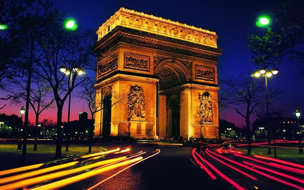 A stunning HD wallpaper featuring the illuminated Arc de Triomphe against a twilight sky, with vibrant light trails from passing vehicles enhancing the scene.