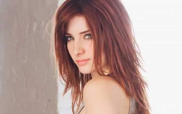 A close-up portrait of Susan Coffey, featuring her soft expression and tousled hair, serves as a striking HD PC desktop wallpaper and background.