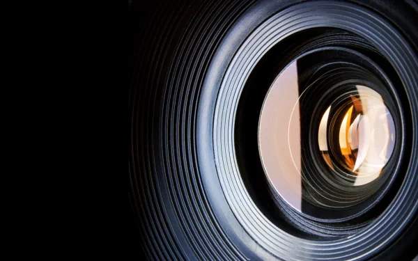 A close-up view of a camera lens, showcasing intricate details and reflections. This 4K Ultra HD image serves as an engaging desktop wallpaper and background.